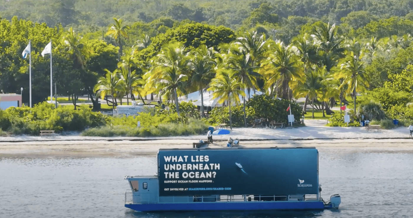 Miami digital billboard boat featuring an ad for SeaKeepers